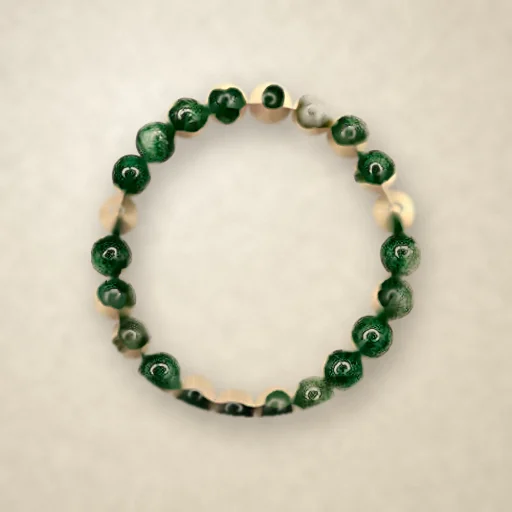Green Aventurine beaded bracelet, photographed on warm paper