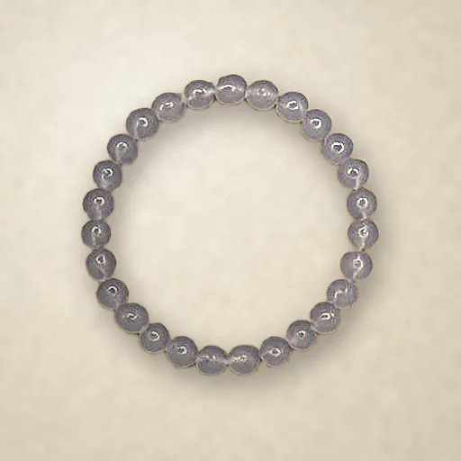 Blue Chalcedony beaded bracelet, photographed on warm paper