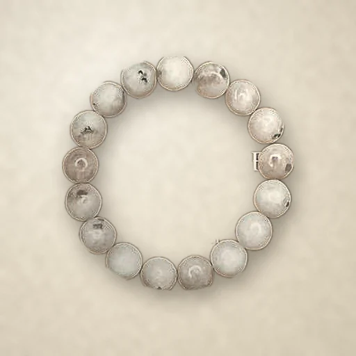 Rainbow Moonstone beaded bracelet, photographed on warm paper
